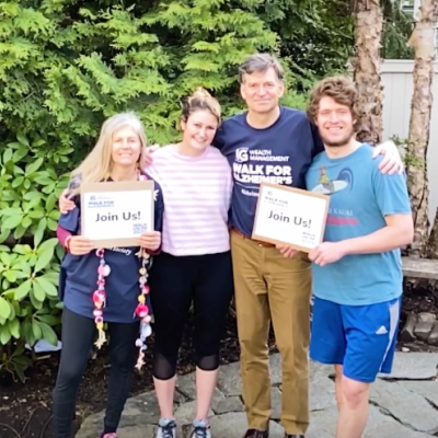 Jeff Carney, former CEO of IG Wealth Management, and his family standing outside, smiling in support of the IG Wealth Management Walk for Alzheimer's.