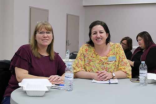 Two representatives from Yorkton Public Library sitting at a table after lunch.