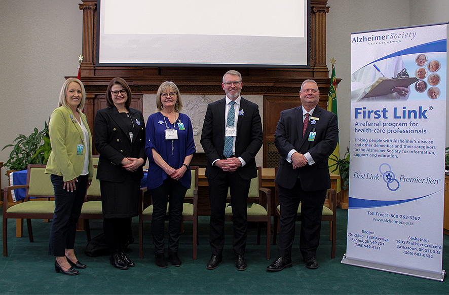 Joanne Bracken, CEO Alzheimer Society of Saskatchewan; Carla Beck, Leader of the Official Opposition; Elaine Unrau, Family Caregiver; Honourable Everett Hindley; and, Dan Kohl, President, Alzheimer Society of Saskatchewan Board of Directors. 