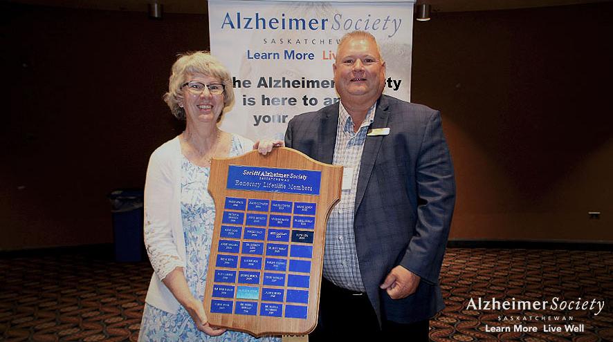 Our president, Dan Kohl, presenting one of our long-term volunteers an award at our 2022 AGM.