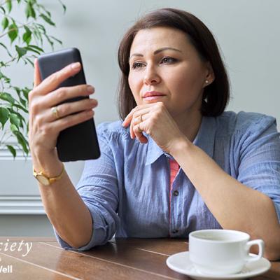 A woman researching on her phone.