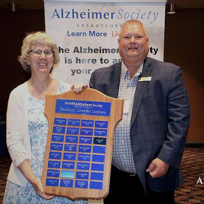 Our president, Dan Kohl, presenting one of our long-term volunteers an award at our 2022 AGM.