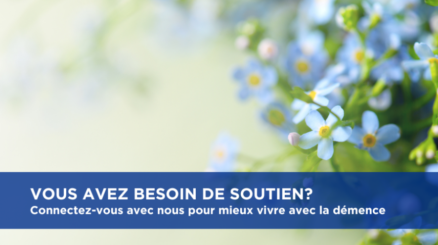 un champ de myosotis sur lequel on peut lire : «  Vous avez besoin de soutien? Connectez-vous avec nous pour mieux vivre avec la démence »
