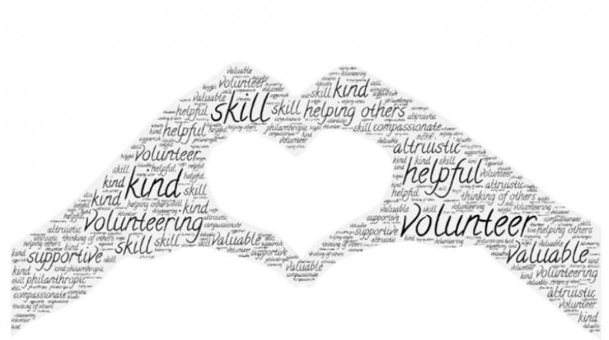 Word art about volunteering in the shape of hands making a heart