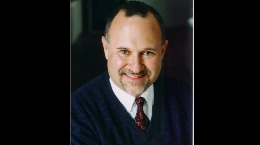 Head and shoulder shot of dementia expert David Troxel on a black background