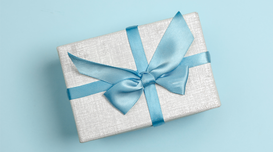 Silver gift box wrapped in blue ribbon