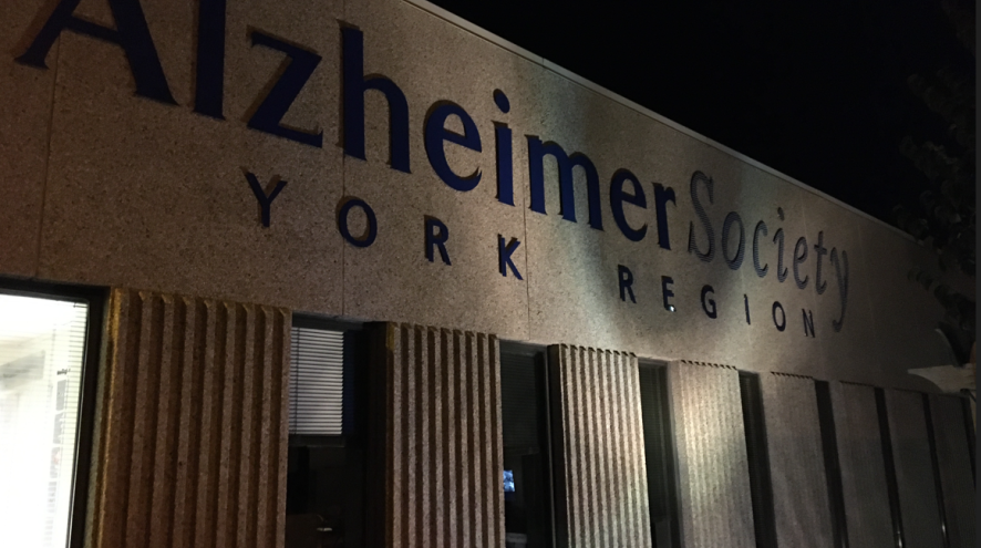 Front of the Alzheimer Society of York Region's Edward Street office lit up in blue.